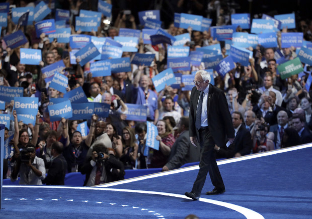 Former Democratic Presidential candidate Sen. Bernie Sanders I-Vt. takes the stage during the first day of the Democratic National Convention in Philadelphia, Monday