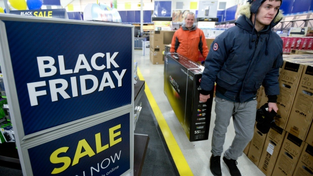 Shoppers at a Best Buy store in Ottawa partake in some deals on Friday. Black Friday in Canada is still a muted affair and it seems to be quieter than normal this year