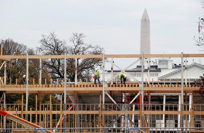 Construction continues on the presidential reviewing stand on Pennsylvania Avenue in Washington Friday Nov. 25 2016 looking toward the White House and the Washington Monument. The reviewing stand is where then President Donald Trump will view the inau