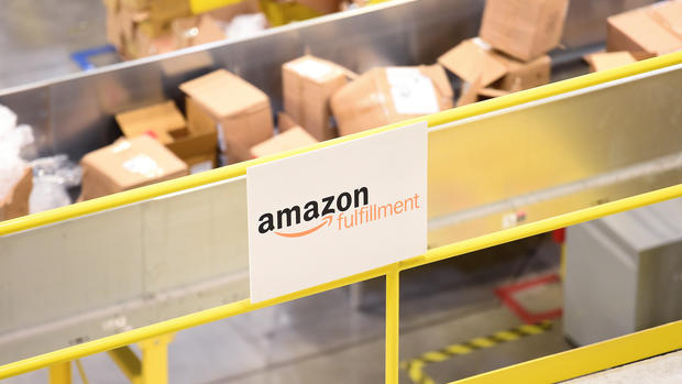 Boxes move along a conveyor belt at an Amazon Fulfillment Center on Cyber Monday in Tracy California