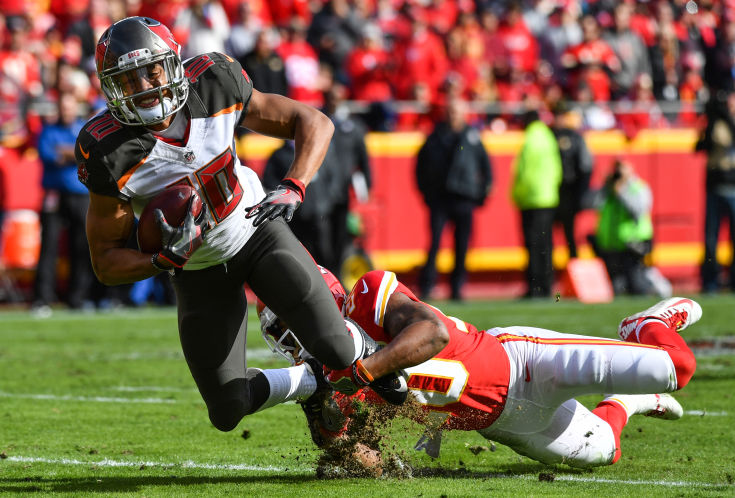 KANSAS CITY MO- NOVEMBER 20 Wide receiver Cecil Shorts #10 of the Tampa Bay Buccaneers is tackled by cornerback Steven Nelson #20 of the Kansas City Chiefsat Arrowhead Stadium during the first quarter of the game