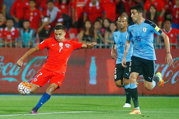 SANTIAGO CHILE- NOVEMBER 15 Alexis Sanchez of Chile shoots to score the second goal of his team during a match between Chile and Uruguay as part of FIFA 2018 World Cup Qualifiers at Nacional Julio Martinez Pradanos Stadium