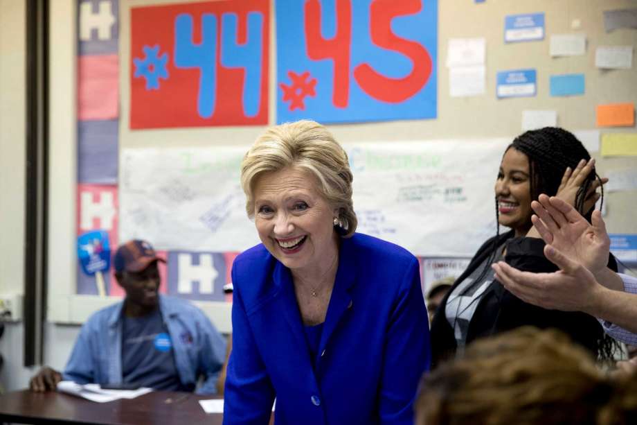 Democratic presidential candidate Hillary Clinton greets workers at a campaign field office in North Las Vegas Nev. Wednesday Nov. 2 2016