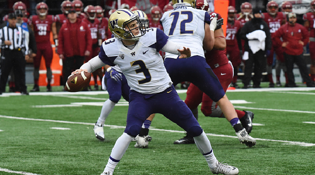 PULLMAN WA- NOVEMBER 25 Washington sophomore quarterback Jake Browning rears back to throw a long completion during the game between the University of Washington Huskies and the Washington State University Cougars