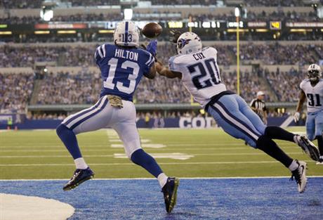 Indianapolis Colts wide receiver T.Y. Hilton makes a catch for a touchdown over Tennessee Titans cornerback Perrish Cox during the first half of an NFL football game in Indianapolis Sunday Nov. 20 2016