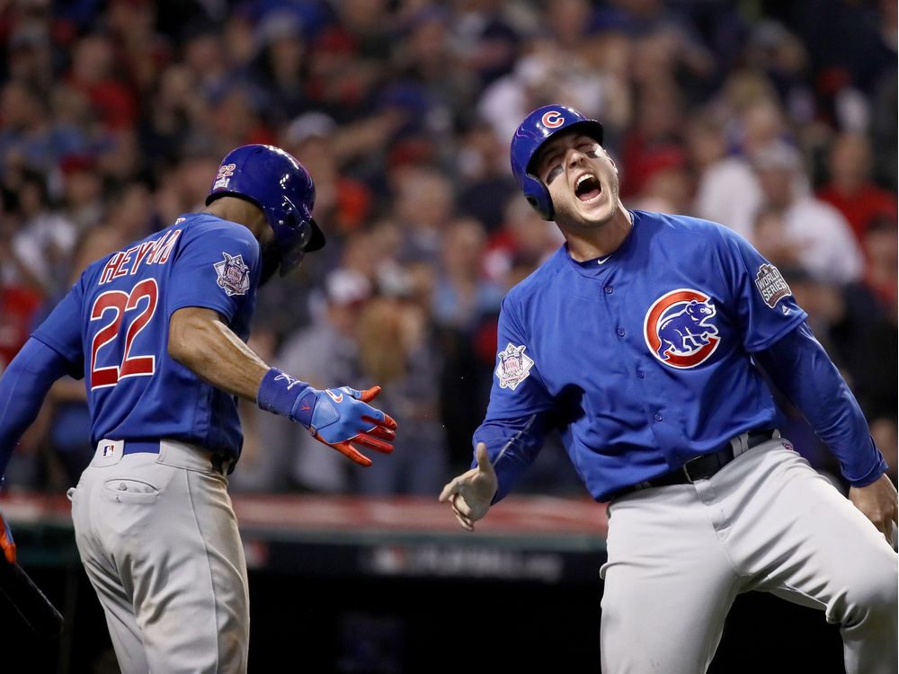 CLEVELAND OH- NOVEMBER 02 Anthony Rizzo #44 of the Chicago Cubs celebrates with Jason Heyward #22 after Rizzo scores a run in the 10th inning on a Miguel Montero #47 against the Cleveland Indians in Game Seven of the 2016 World Series at Progressive Fi