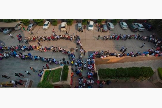 Indians stand in queues at a bank to exchange or deposit discontinued currency notes in New Delhi India Tuesday Nov. 15 2016. Chaotic scenes played out across India with long lines growing even longer and scuffles breaking out as millions of anxious