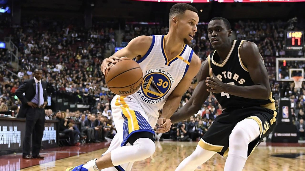 Golden State Warriors guard Stephen Curry drives against Toronto Raptors forward Pascal Siakam during the second half of an NBA basketball game Wednesday Nov. 16 2016