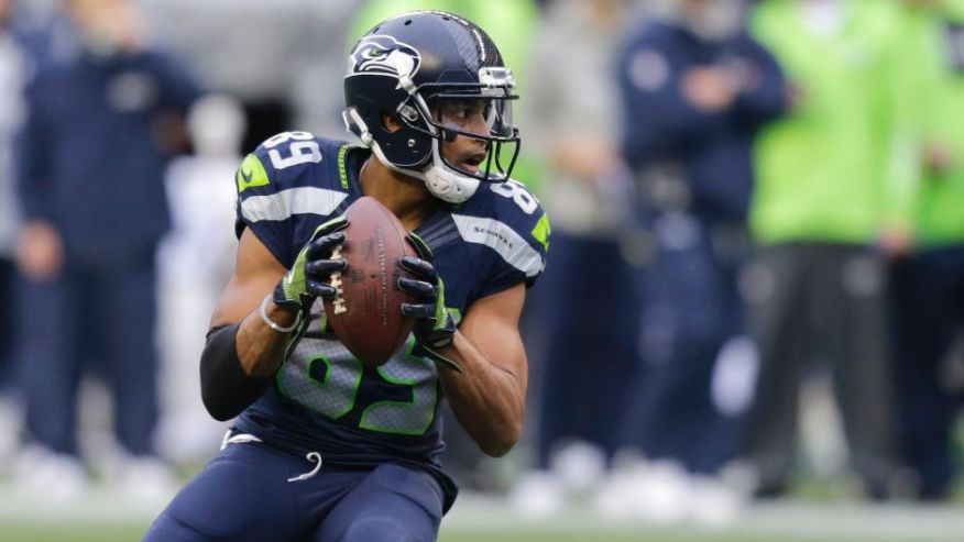 Seattle Seahawks wide receiver Doug Baldwin gets set to pass to quarterback Russell Wilson for a touchdown against the Philadelphia Eagles in the second half of an NFL football game Sunday Nov. 20 2016 in Seattle