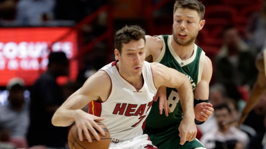 Miami Heat guard Goran Dragic drives to the basket as Milwaukee Bucks guard Matthew Dellavedova defends during the first half of an NBA basketball game Thursday Nov. 17 2016 in Miami