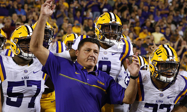 BATON ROUGE LA- OCTOBER 22 Head coach Ed Orgeron of the LSU Tigers leads his team on the field before a game against the Mississippi Rebels at Tiger Stadium