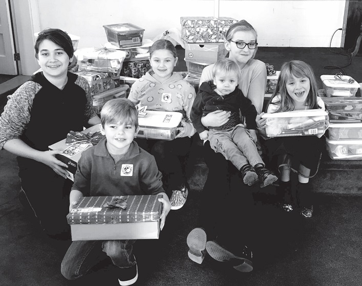 Some of the children from families who have contributed shoeboxes when the boxes were collected on November 13 in the morning worship service. Contributed