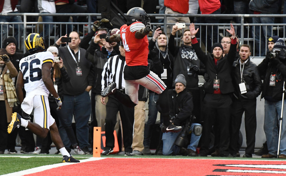 COLUMBUS OH- NOVEMBER 26 Ohio State University halfback Curtis Samuel leaps over the goal line to score the game-winning touchdown against the Michigan Wolverines in the second overtime of their NCAA football game Saturday