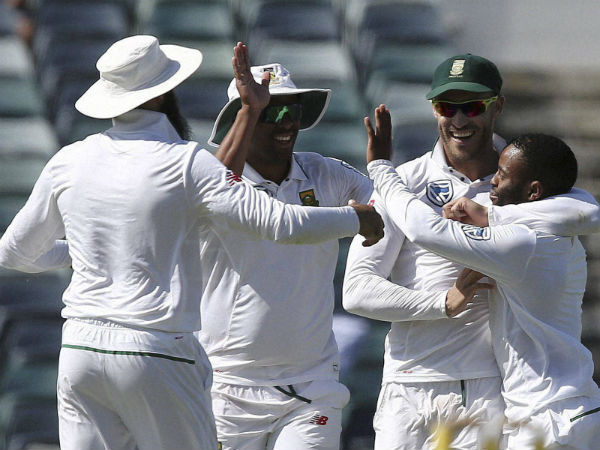 South Africa's captain Faf du Plessis second from right celebrates with teammate Temba Bavuma