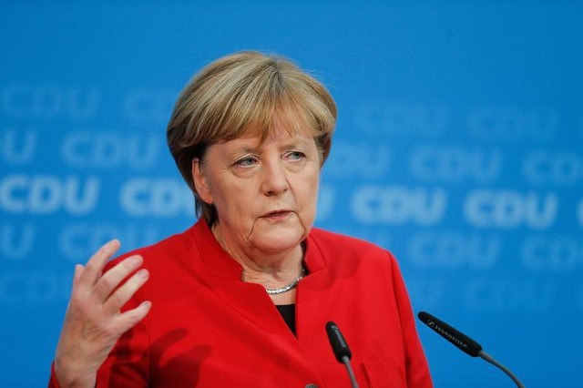 German Chancellor Angela Merkel addresses a news conference to announce that she will run again for the Chancellorship in the next year general elections at the Christian Democratic Union Party headquarters in Berlin Germany November 20. Credit