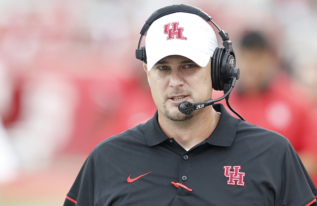 HOUSTON TX- SEPTEMBER 10 Houston Cougars head coach Tom Herman walks the sidelines as he coaches against the Lamar Cardinals in the second quarter at TDECU Stadium