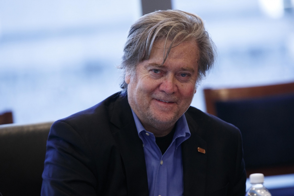 Steve Bannon campaign CEO for Republican presidential candidate Donald Trump right looks on during a national security meeting with advisors at Trump Tower Friday Oct. 7 2016 in New York