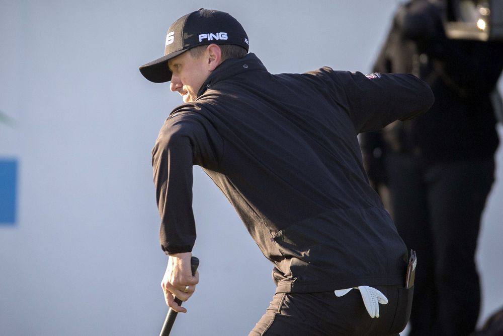 Mackenzie Hughes of Canada pumps his fist after sinking a par putt on the 17th hole during the playoff round at the RSM Classic golf tournament Monday Nov. 21 2016 in St. Simons Island Ga