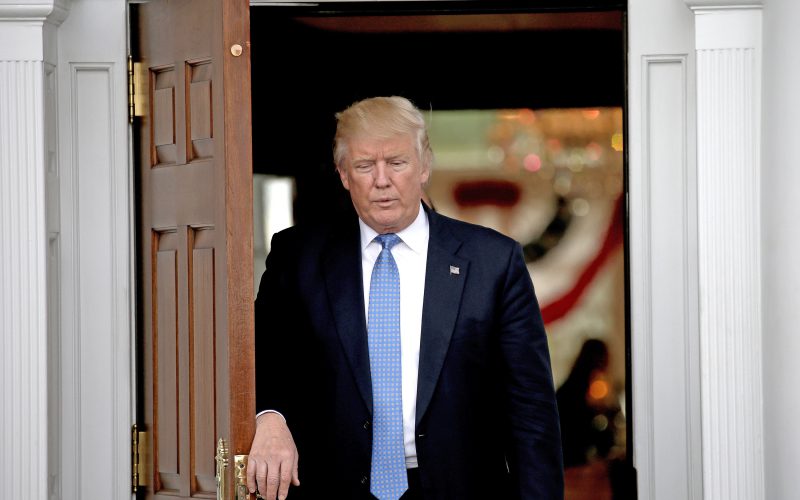 United States President-elect Donald Trump comes out to welcome a guest at the clubhouse of Trump International Golf Club on Nov. 20 2016 in Bedminster Township N.J. Trump canceled a meting with the New York Times on Tuesday. (Peter Foley  CNP  Zuma Press