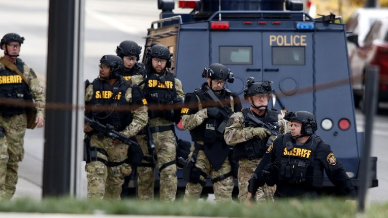 Law enforcement officials are seen outside of a parking garage on the campus of The Ohio State University as they respond to an active attack in Columbus Ohio