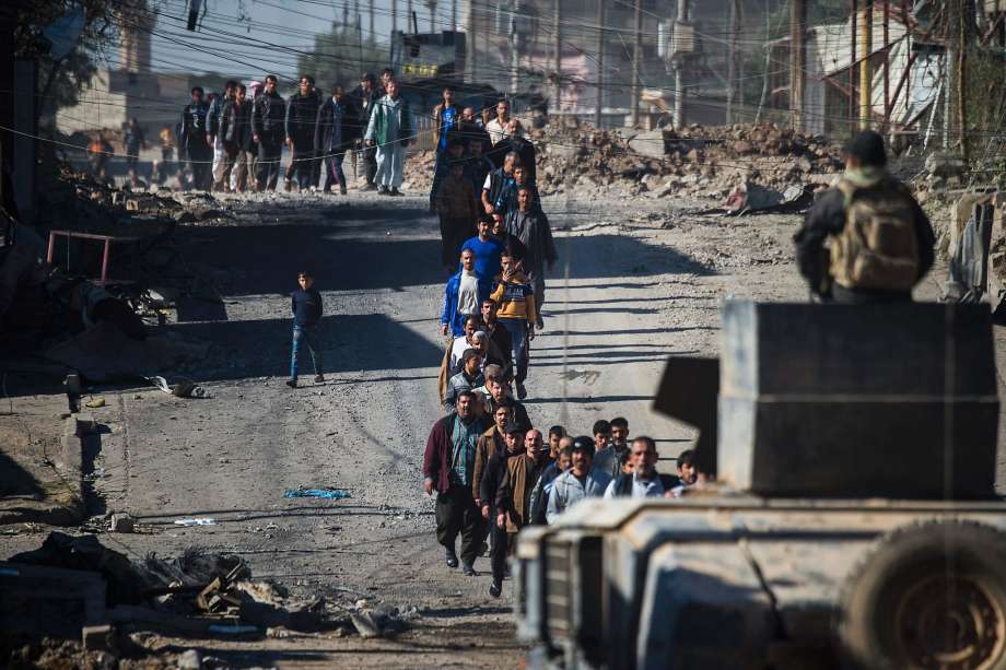 Iraqi Special Forces round up men to check their identity in Mosul’s eastern district of Karkukli during a massive operation to retake the last Islamic State-held city in the country