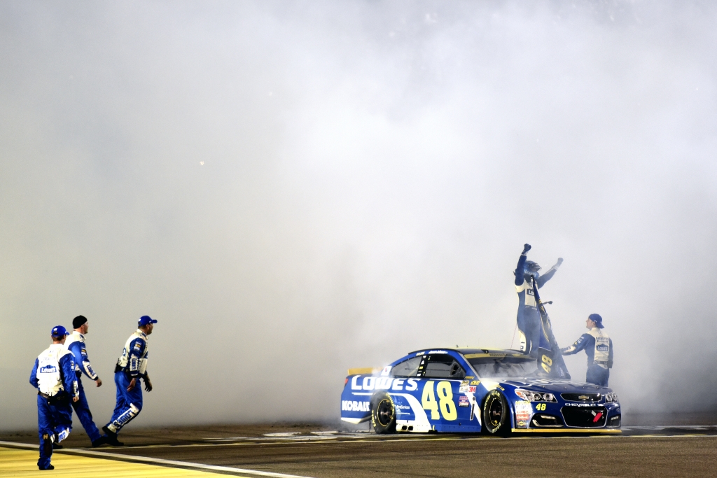 HOMESTEAD FL- NOVEMBER 20 Jimmie Johnson driver of the #48 Lowe's Chevrolet celebrates after winning the NASCAR Sprint Cup Series Ford Eco Boost 400 and the 2016 NASCAR Sprint Cup Series Championship at Homestead Miami Speedway