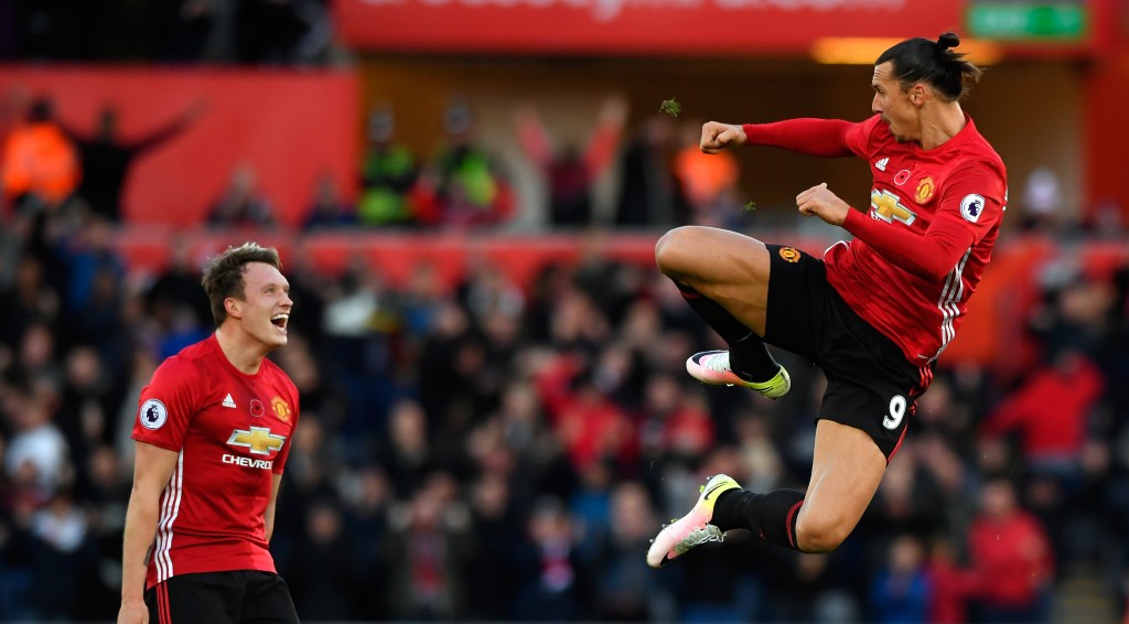 SWANSEA WALES- NOVEMBER 06  Zlatan Ibrahimovic of Manchester United celebrates scoring his sides second goal with Phil Jones during the Premier League match between Swansea City and Manchester United at Liberty Stadium