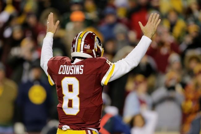 Washington Redskins quarterback Kirk Cousins celebrates running back Rob Kelley's touchdown during the second half of an NFL football game against the Green Bay Packers in Landover Md. Sunday Nov. 20 2016