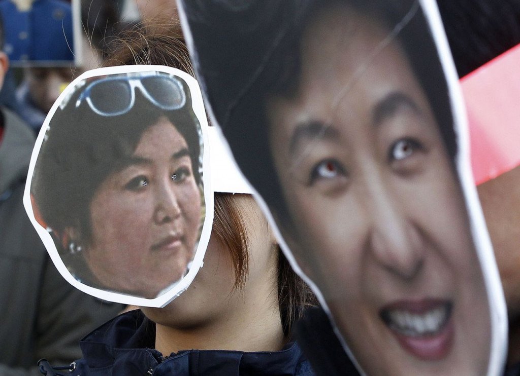 Protesters wear masks of South Korean President Park Geun-hye right and Choi Soon-sil who is at the center of a political scandal at a Nov. 2 2016 rally in Seoul calling for Park to step down. Associated Press  Ahn Young-joon