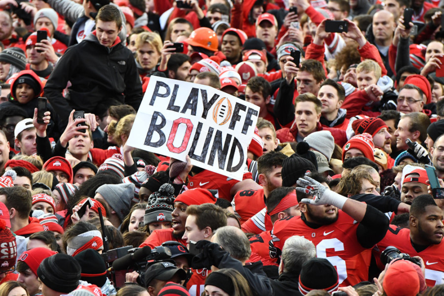 COLUMBUS OH- NOVEMBER 26 Happy Ohio State Buckeyes fans celebrate their 30-27 double overtime win over the Michigan Wolverines in their NCAA football game Saturday