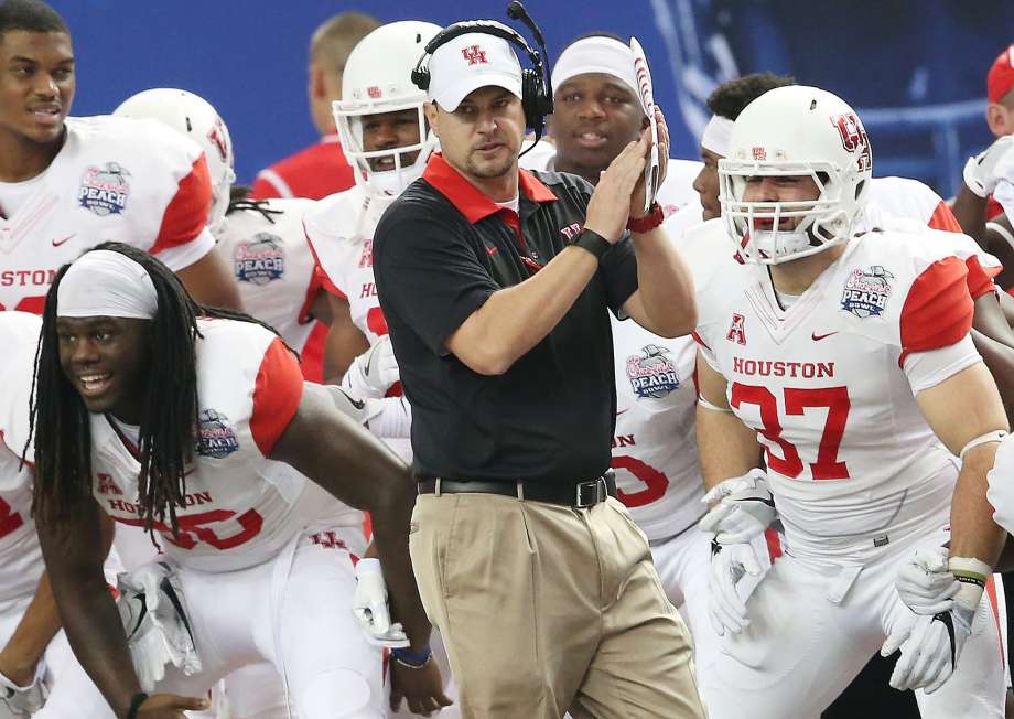 Houston head coach Tom Herman watches play against Florida State during the first half of the Peach Bowl NCAA college football game in Atlanta. The AAC notched 10 wins in 2015 against Power Five conference teams