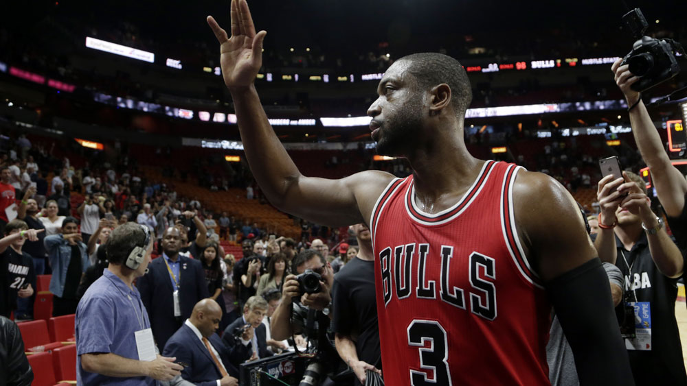 Dwayne Wade greets fans from his former team the Miami Heat after the Bulls three point victory