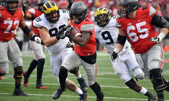 COLUMBUS OH- NOVEMBER 26  Curtis Samuel #4 of the Ohio State Buckeyes rushes for the game-winning touchdown in overtime against the Michigan Wolverines at Ohio Stadium