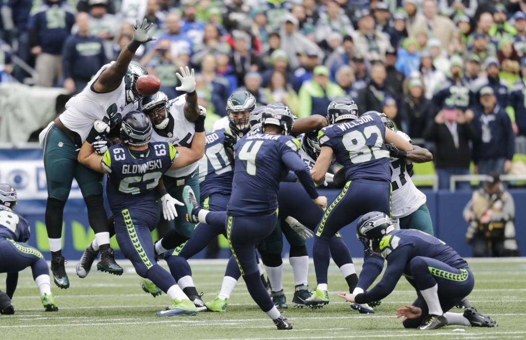 Seattle Seahawks kicker Steven Hauschka has a point-after attempt blocked by Philadelphia Eagles defensive tackle Bennie Logan upper left in the first half of an NFL football game Sunday Nov. 20 2016 in Seattle