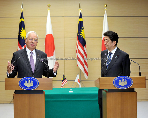 Najib and Abe during a joint press conference in Tokyo. — Bernama