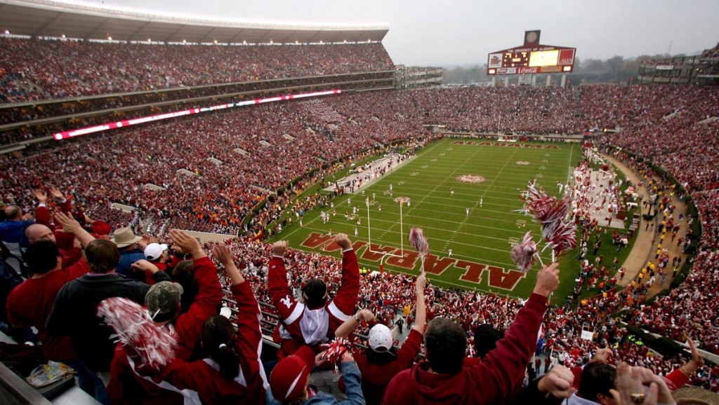 Alabama college football fans cheer during the Iron Bowl NCAA college football game against Auburn at Bryant Denny Stadium in Tuscaloosa Alanta