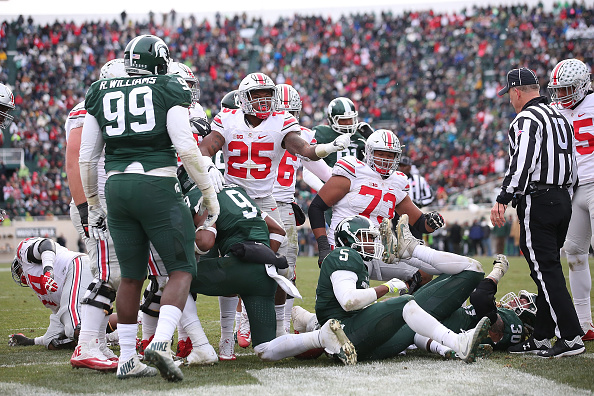 EAST LANSING MI- NOVEMBER 19 Mike Weber #25 of the Ohio State Buckeyes scores a third quarter touchdown during the game against the Michigan State Spartans at Spartan Stadium