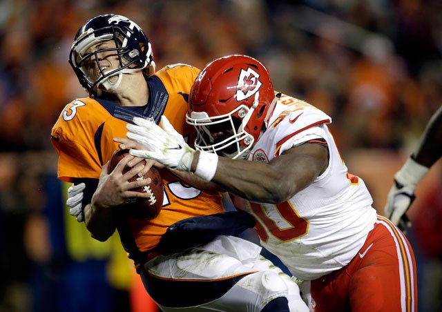 Kansas City Chiefs outside linebacker Justin Houston sacks Denver Broncos quarterback Trevor Siemian in the end zone for a safety during the first half of an NFL football game Sunday Nov. 27 2016 in Denver