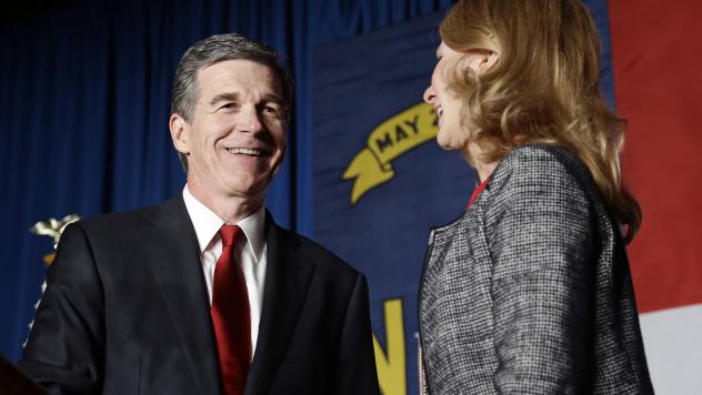 Democratic challenger Roy Cooper has a lead of more than 6,000 votes over Gov. Pat McCrory. He's seen here with his wife Kristin at an election night rally in Raleigh