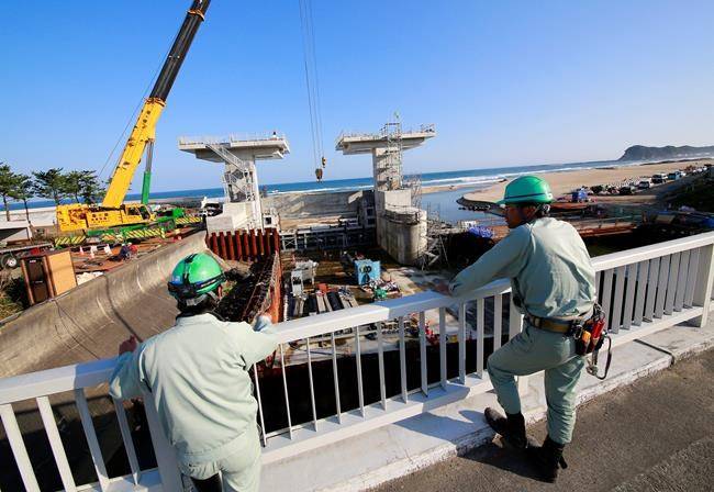 Powerful quake hits Japan, Fukushima residents urged to flee tsunami