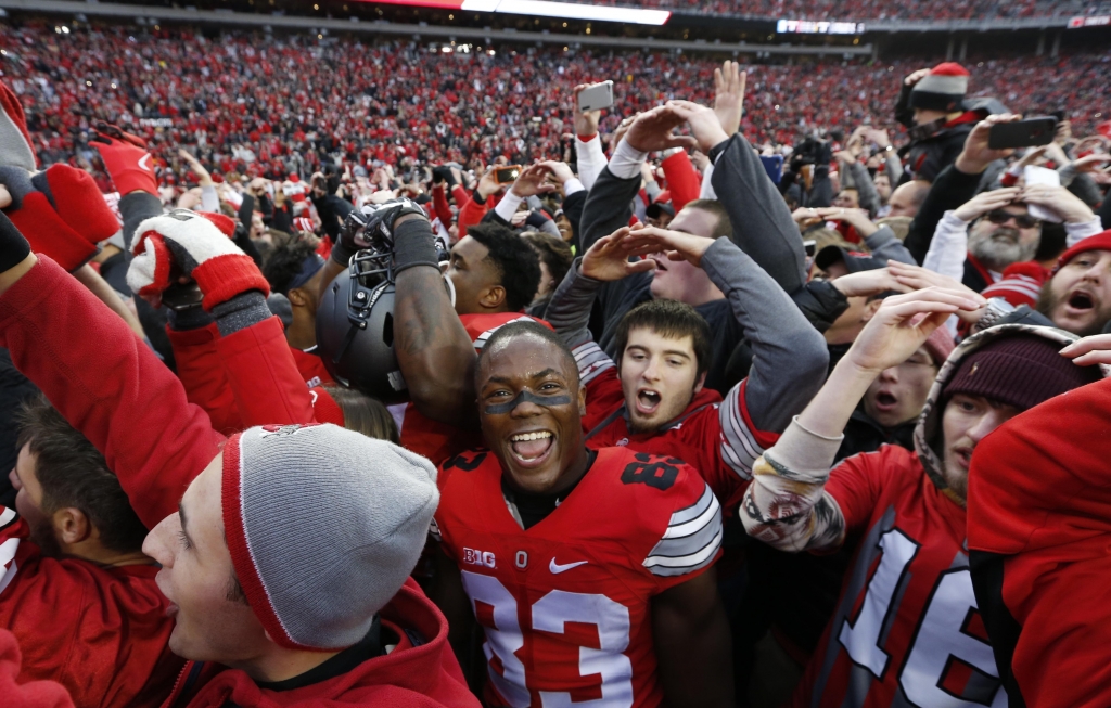 Ohio State players and fans celebrate their win over Michigan on Saturday Nov. 26 2016 in Columbus Ohio