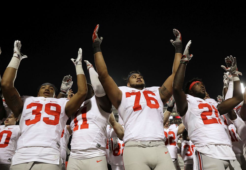 Ohio State players sing after an NCAA college football game against Maryland in College Park Md. Saturday Nov. 12 2016