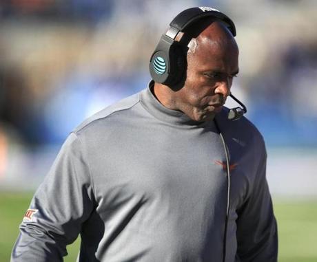 Texas head coach Charlie Strong walks the sideline during the first half of an NCAA college football game against Kansas in Lawrence Kan. Saturday Nov. 19 2016