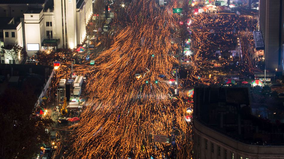 People flowing down the streets and alleyways