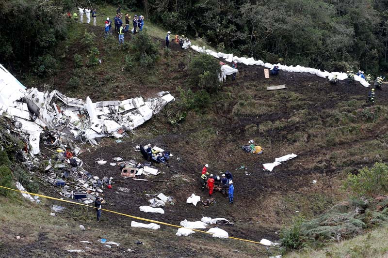 Rescue crew work at the wreckage of a plane that crashed into the Colombian jungle with Brazilian soccer team Chapecoense near Medellin