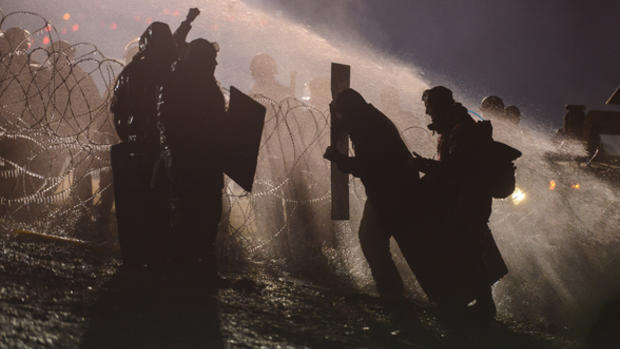 Police use a water cannon on protesters during a Nov. 21 protest near the Standing Rock Indian Reservation. REUTERS  Stephanie Keith