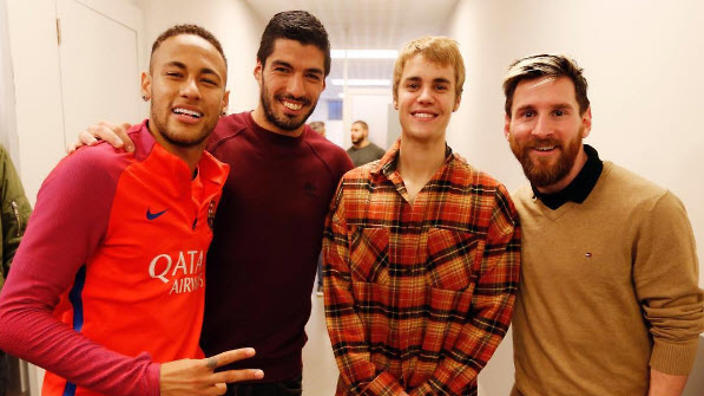 Pop star Justin Beiber with Barcelona players Neymar, Luis Suarez and Lionel Messi