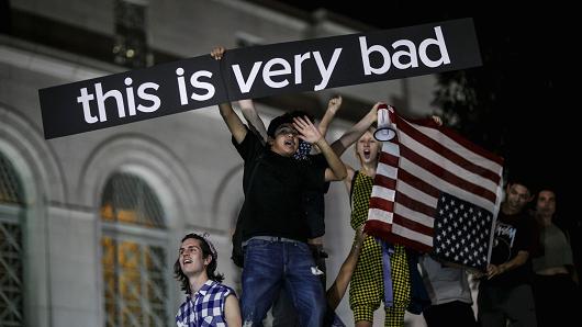 Anti-Trump protesters gather outside City Hall to protest the president-elect Donald Trump by chanting 'Not my president not my president,&#039 in Los Angeles Calif. on Nov. 9 2016