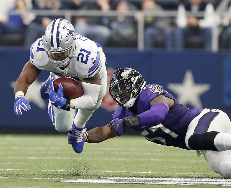 Dallas running back Ezekiel Elliott is tripped up by Baltimore linebacker C.J. Mosley. The Cowboys won their ninth straight game