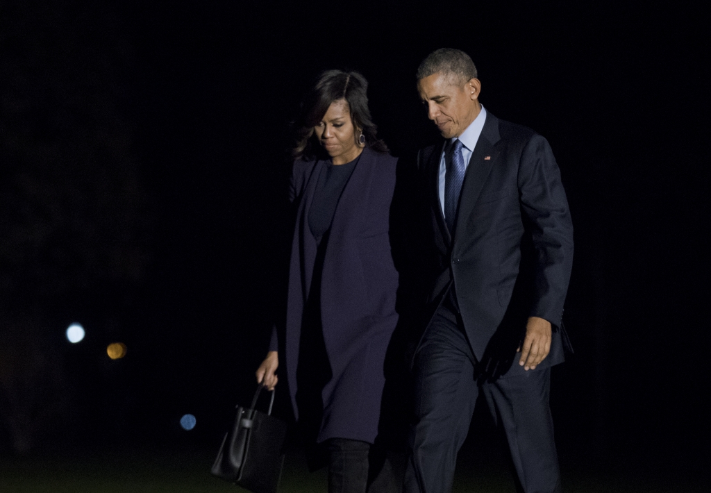 President Barack Obama and first lady Michelle Obama walk on the South Lawn upon arrival to the White House in Washington Monday Nov. 7 2016 from a campaign event in Philadelphia Pa. on the final day of the 2016 campaign in a final push for Democrat